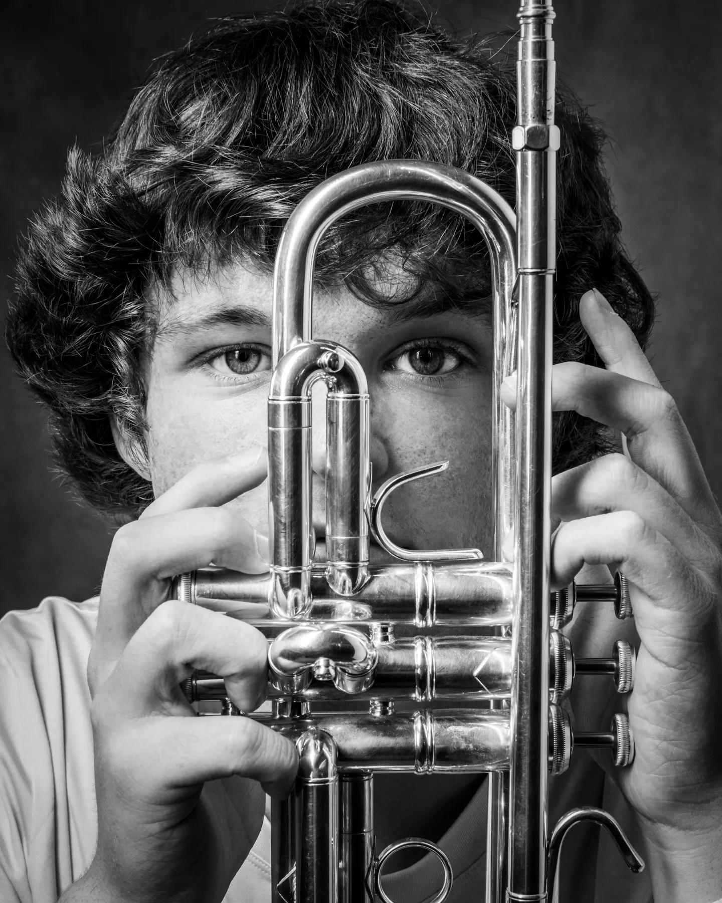 Musician with trumpet at his photo session at Richard Hill Studio Dallas